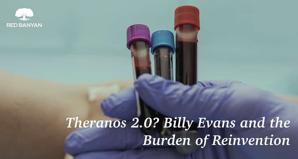 hand with elastic gloves holding blood viles in front of an arm