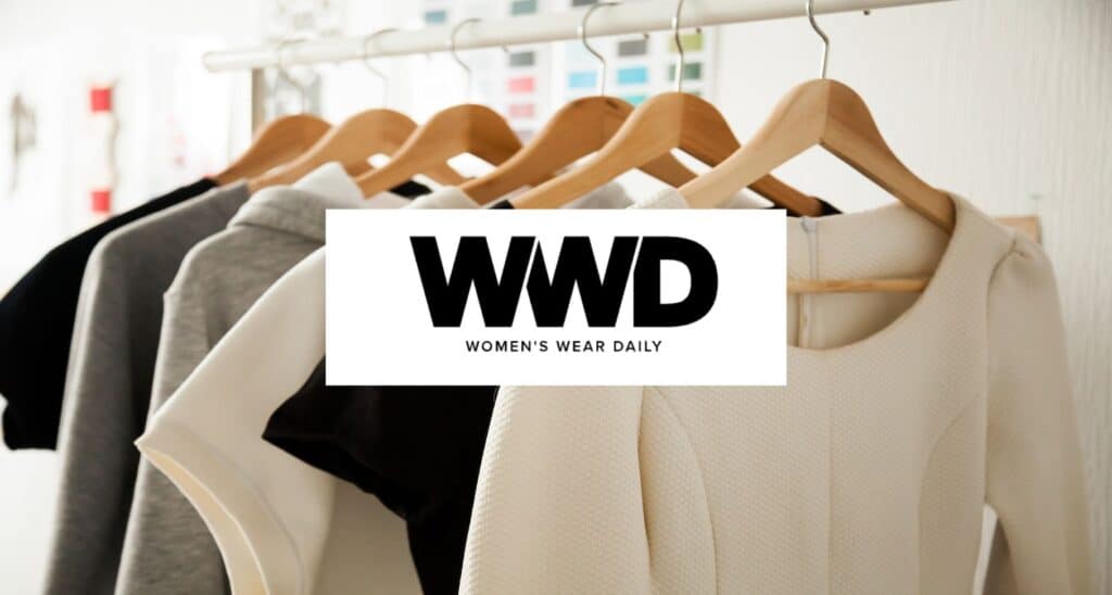 Media outlet logo in front of women's clothes