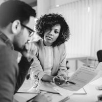 couple-preparing-to-sign-a-contract-of-sale-picture-id1314879006