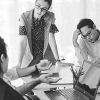 unhappy-business-people-in-group-meeting-picture-id1190947447